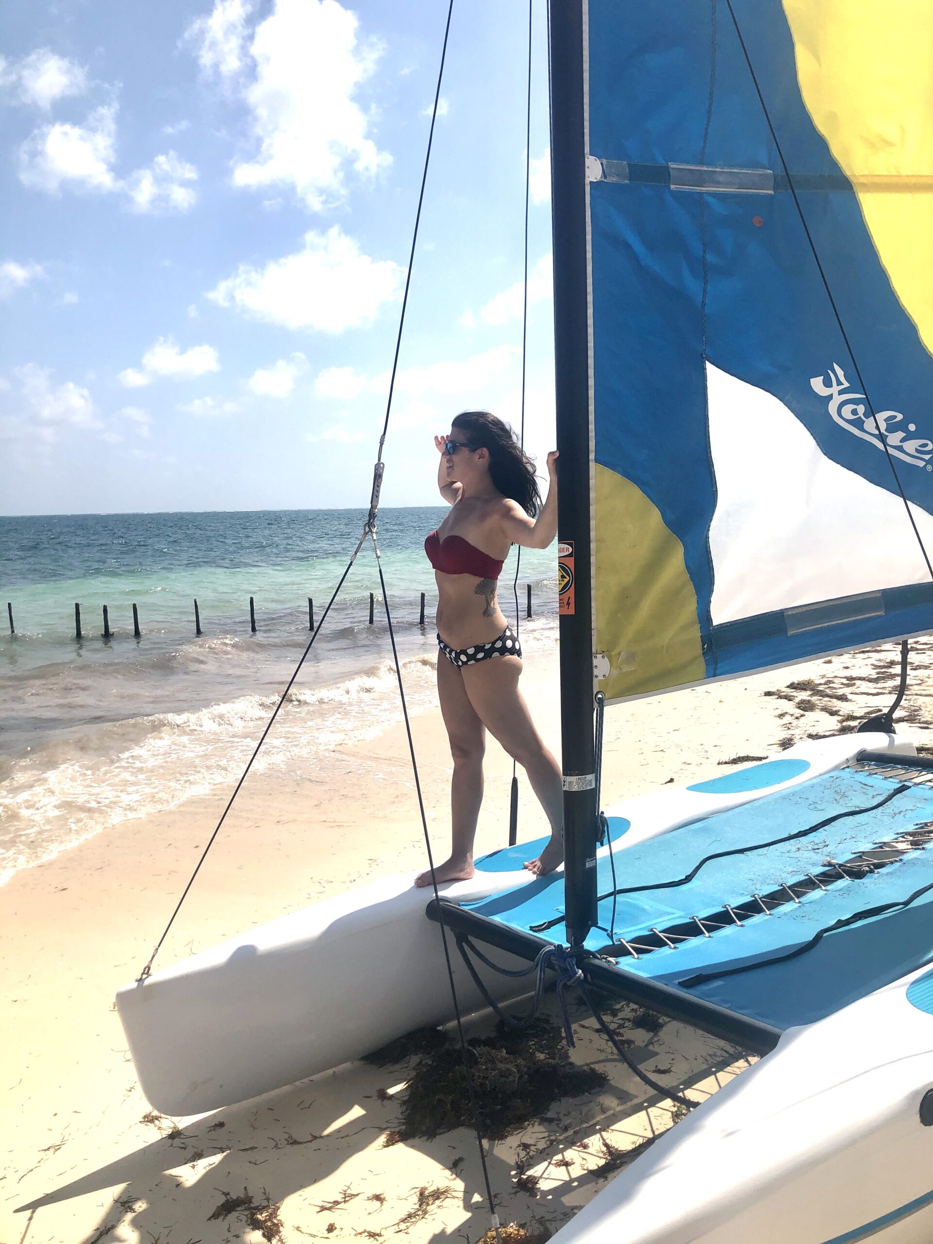 Woman sailing on a catamaran.